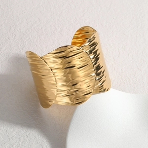 Irregular wide open bangle with 18K gold plated water ripple texture in stainless steel