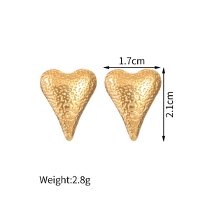 Detail view of gold hammered heart earrings showing dimensions 1.7cm by 2.1cm size