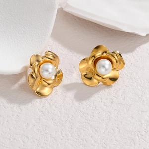 Elegant gold flower stud earrings with white pearl center on a clean white background