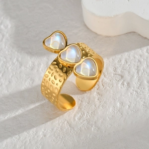 Gold plated open heart ring with textured hammer finish and iridescent gemstones