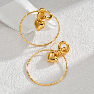 Minimalist gold titanium steel hoop earrings featuring small heart pendants on stone