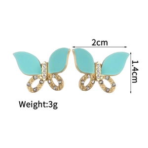 Detailed view of butterfly stud earrings with dimensions 2cm by 1.4cm and 3g weight