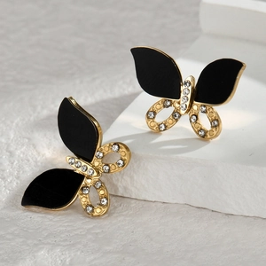 Elegant butterfly stud earrings with black and gold details and sparkling cubic zirconia