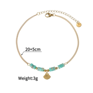 Detail of 18k gold stainless steel anklet with green beads and a shell charm pendant