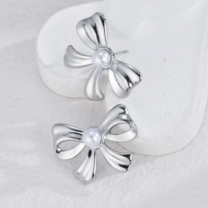 Elegant silver bow earrings with white pearl inlay, stylish minimalist jewelry for women