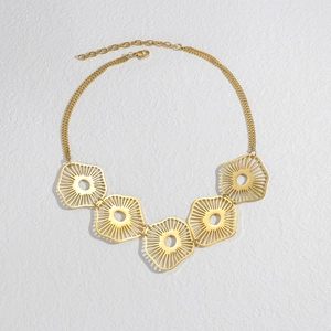 Detail of gold dragonfly style necklace with five sunburst circular charms on triple chains