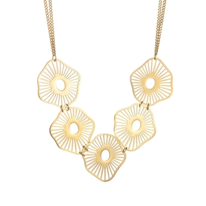 Detail of dragonfly style pendant with hollow gold circular motifs on a layered chain