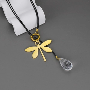 Golden dragonfly necklace with teardrop crystal pendant on a black cord necklace