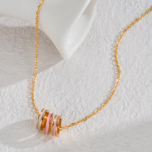 Elegant gold stainless steel necklace with pink and white enamel triple ring pendant
