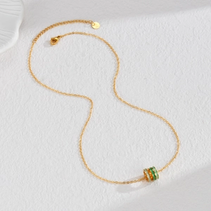 Three-ring enamel cylinder pendant on a gold stainless steel necklace for women