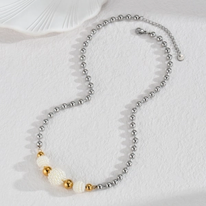 Detail of stainless steel bead necklace showing the S.Steel tag and lobster clasp