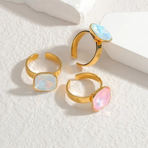 Elegant gold adjustable rings with square iridescent gemstones in blue, white and pink