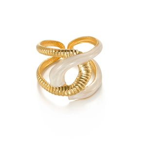 Detail of gold titanium wrap ring featuring white enamel drip and textured spiral design