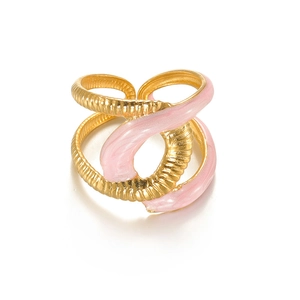 Detail of gold titanium ring with pink enamel inlay and cross-winding textured band