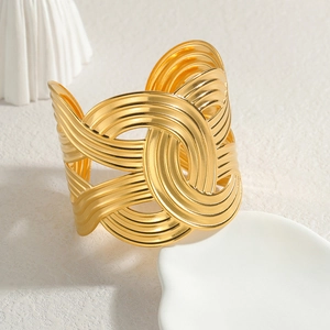 Minimalist wide gold cuff bracelet with geometric hollow interlaced circular lines
