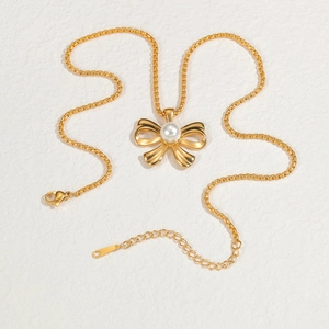 French style gold pearl bow necklace with thick link chain and adjustable extension