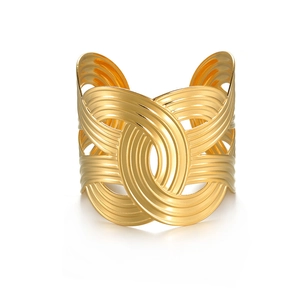 Minimalist wide gold cuff bracelet featuring multi-layer curved textures and cutouts