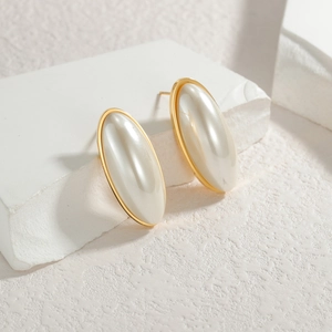 Detail of oval mother-of-pearl stud earrings with gold-plated stainless steel frames