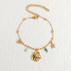 Ocean themed 18k gold plated titanium steel bracelet with shell and starfish charms