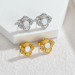 Macro view of flower stud earrings featuring white shell inlay and metallic petals