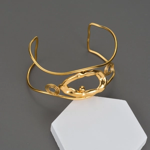 Bracciale rigido dorato in acciaio inossidabile con design a onde e perla metallica