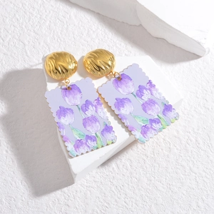 Bohemian vintage butterfly style earrings with purple tulip floral print on white stand