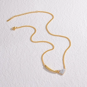 Elegant gold-tone stainless steel heart necklace with micro-pave crystals on white texture