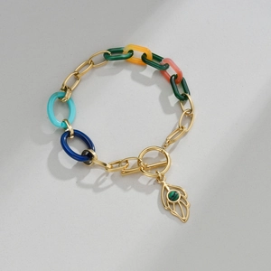 Golden leaf bracelet with colorful resin links and turquoise stone toggle clasp