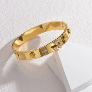 Bracelet jonc en acier inoxydable doré 18 carats avec zircons et relief floral