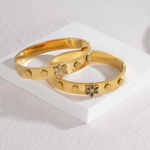 Elegant gold stainless steel flower bangles with black and white zircon stone accents