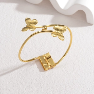 18K gold plated stainless steel open bangle featuring two detailed butterfly ornaments