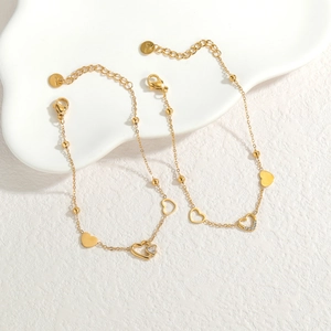 Gold stainless steel heart bracelets with hollow charms and sparkling zircon stones