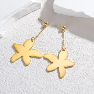 Elegant gold flower drop earrings made of titanium steel on a minimalist white stone background