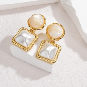 French vintage geometric earrings with gold frame, cream texture, and pearl white resin