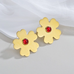 Exaggerated matte gold flower earrings with red gemstone center for women in retro style