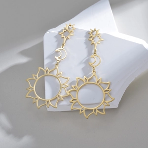18K gold plated stainless steel long drop earrings featuring hollow star and moon charms