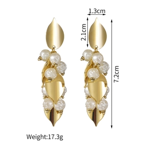 Detail view of gold leaf and white rose earrings with 7.2cm length dimension display