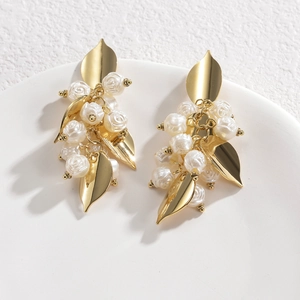 Elegant gold leaf and white rose drop earrings in minimalist vintage style for women