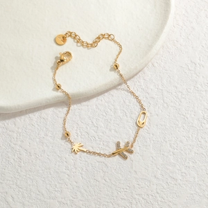 Gold stainless steel bracelet with plane coconut tree and slipper charms for women