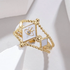 Macro shot of 304 stainless steel gold evil eye ring with white enamel and rhinestone
