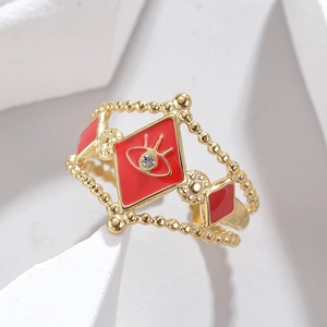 Macro shot of 304 stainless steel ring with red enamel evil eye and beaded edge detail