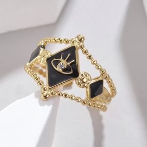 Detailed view of evil eye hollow ring with black oil drip and beaded band