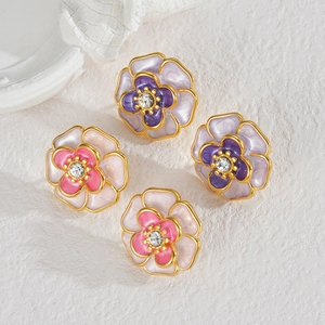 Floral stud earrings with pink and purple enamel petals and crystal centers in gold plating