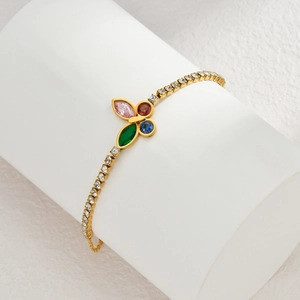 Elegant gold butterfly bracelet with colorful gemstones and sparkling crystal accents