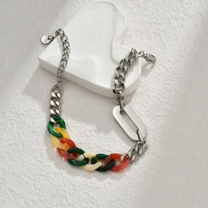 Colorful acrylic and silver stainless steel chunky chain bracelet on white heart background