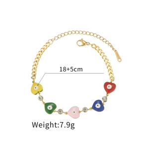 Gold stainless steel bracelet with colorful enamel heart charms and sparkling crystals