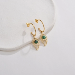 Detailed macro of gold leaf drop earrings with round green malachite textured stone
