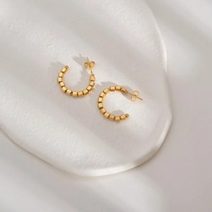14K gold plated C-shaped stainless steel hoop earrings with textured cube bead design