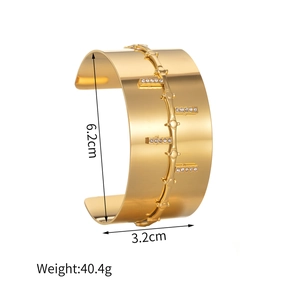 Gold plated stainless steel open bangle with crystal inlay and 3.2cm wide ribbed design