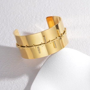 Polished 18K gold-plated stainless steel wide cuff bracelet with double row crystal accents